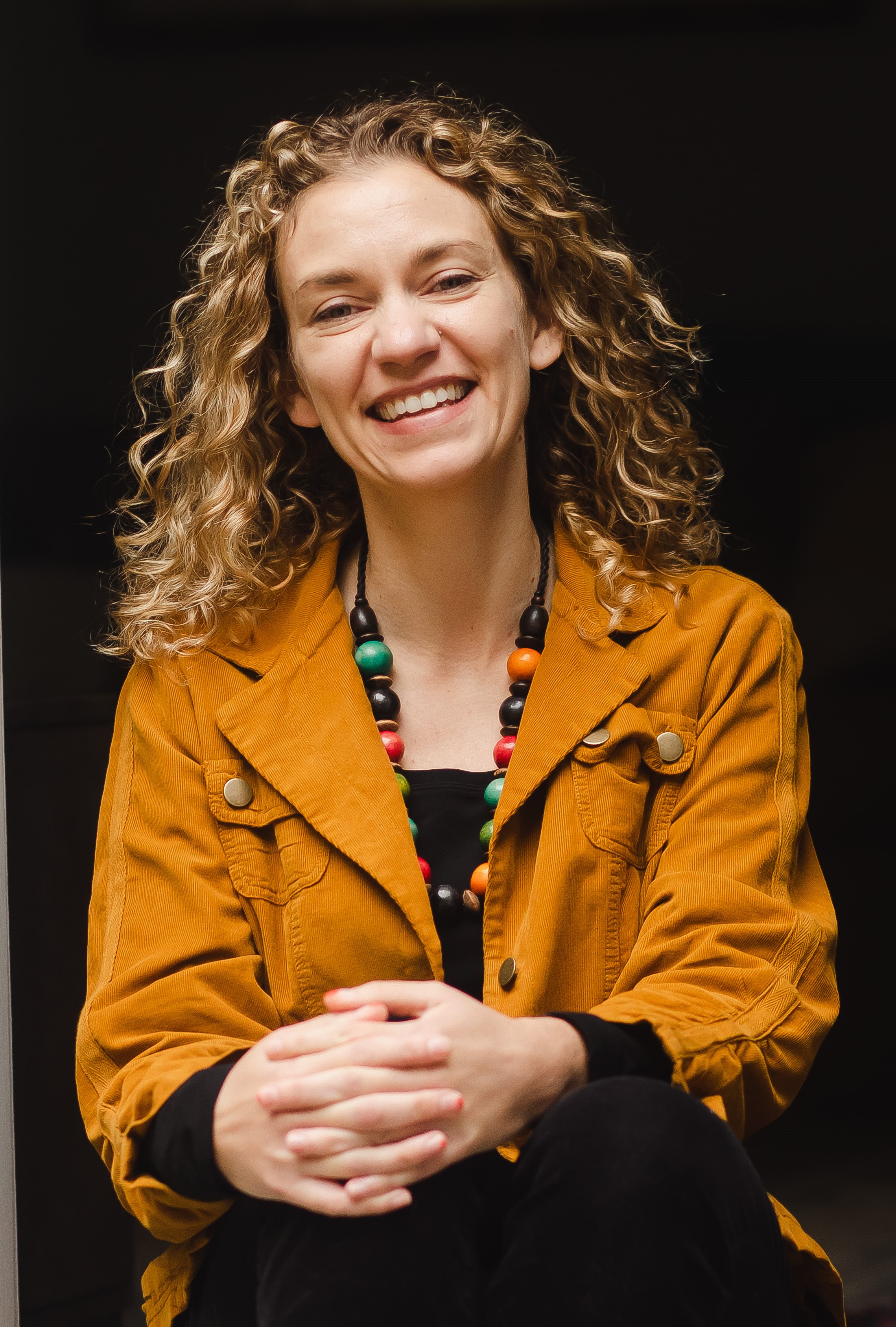 Picture of person with yellow jacket sitting